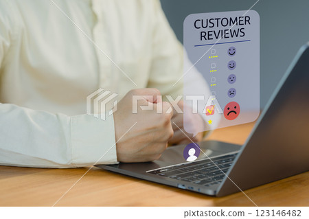 Customer gives feedback on a laptop, rating their experience with a negative review on a customer satisfaction survey, highlighting dissatisfaction with a product or service. 123146482