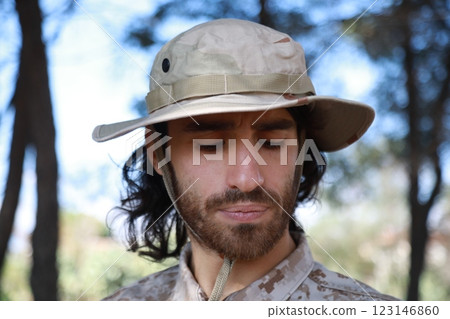 Sad Serviceman Sitting On The Ground In The Countryside Reflects On Memorial Day Sad Serviceman Sitting On The Ground In The Countryside Reflects On Memorial Day 123146860