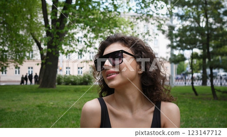 Beautiful woman portrait in a city park in summertime 123147712