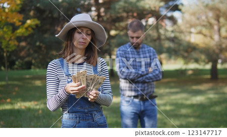 A wife counts her husband's money as a concept of the family budget 123147717