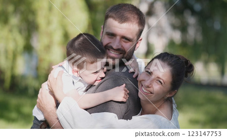 A delightful family portrait showcasing the essence of love, joy, and togetherness in a stunning outdoor setting 123147753