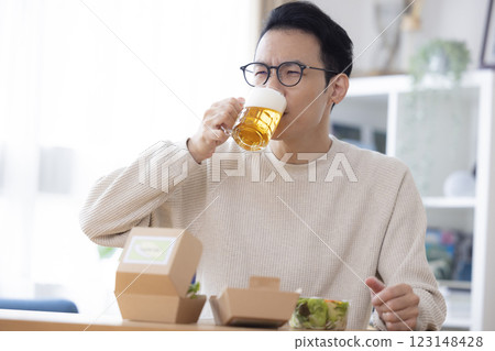 Male drinking beer 123148428