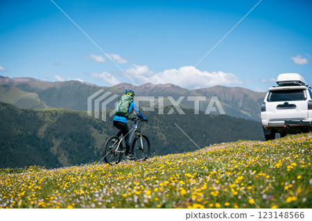 Woman riding mountain bike in forest mountain top 123148566