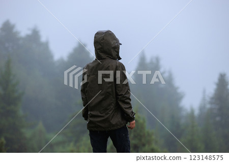 Woman enjoy the rainy forest in summer high altitude mountains 123148575