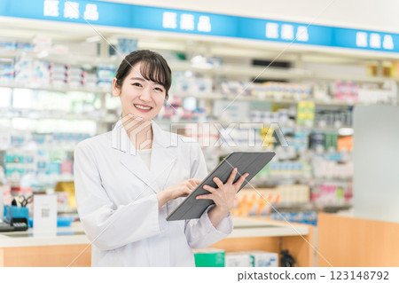 Female pharmacist working at a pharmacy, hospital, or drugstore (prescriptions, medicines, supplements) 123148792