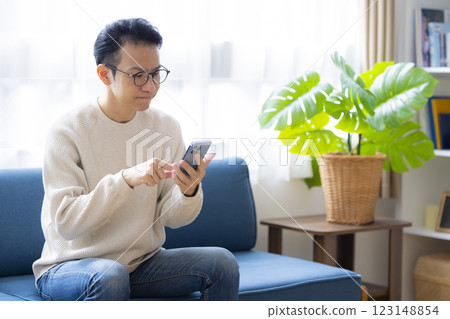 Man looking at a smartphone 123148854