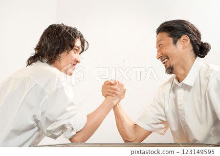 Two men arm wrestling 123149595