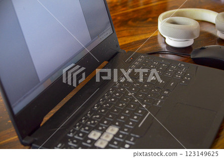 Modern Office Workspace with Laptop and Headphones, banner ,copy space  123149625