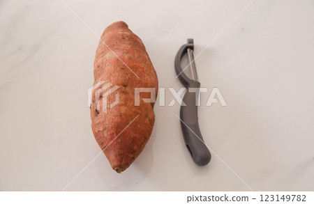 Fresh Sweet Potato Peeler Kitchen Essentials, campaing Fresh Sweet Potato Peeler Kitchen Essentials, campaing 123149782