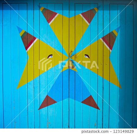 Colorful Geometric Street Art Wooden Door Blue and Yellow Abstract Design in Marsaxlokk, Malta Colorful Geometric Street Art Wooden Door Blue and Yellow Abstract Design in Marsaxlokk, Malta 123149829