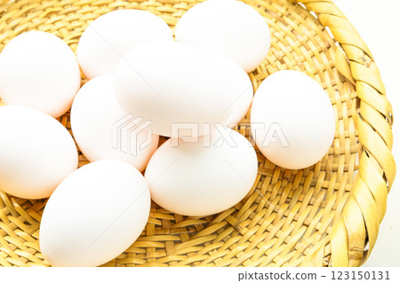 Raw eggs in a colander and copy space Raw eggs in a colander and copy space 123150131