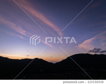 Aerial view of beautiful sunset or sunrise sky over mountains Aerial view of beautiful sunset or sunrise sky over mountains 123150338