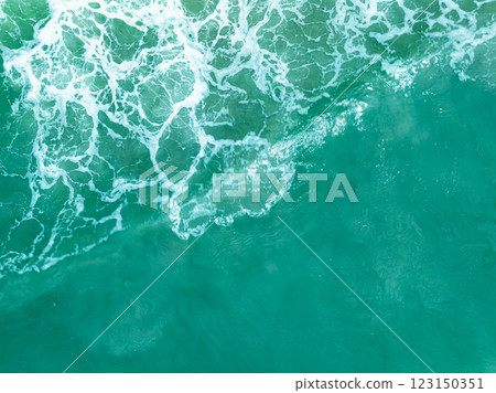 Overhead view turquoise stormy ocean waves with white foam in the ocean,Sea water with splashes and foam, Top view waves background, Natural background photo sea texture with waves soft focus 123150351