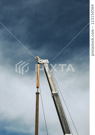 Heavy machinery arm stretching into the sky b-5 film style 123150564