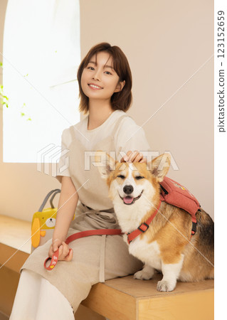 Portrait of a woman sitting with a dog Portrait of a woman sitting with a dog 123152659