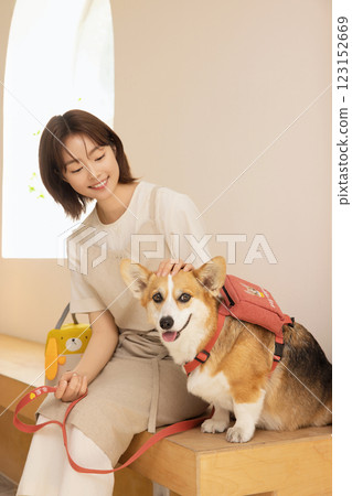 Portrait of a woman sitting with a dog Portrait of a woman sitting with a dog 123152669