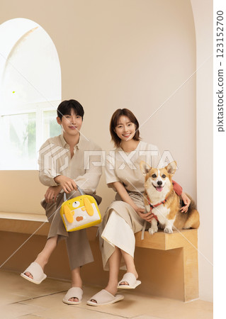 Portrait of a couple sitting with a dog 123152700