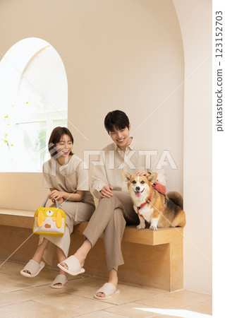 Portrait of a couple sitting with a dog Portrait of a couple sitting with a dog 123152703