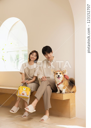 Portrait of a couple sitting with a dog Portrait of a couple sitting with a dog 123152707
