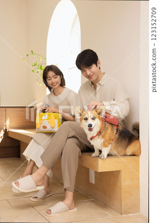 Portrait of a couple sitting with a dog Portrait of a couple sitting with a dog 123152709