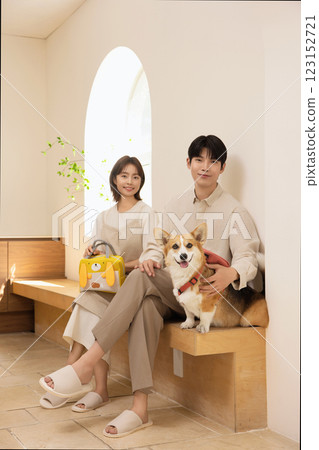 Portrait of a couple sitting with a dog Portrait of a couple sitting with a dog 123152721