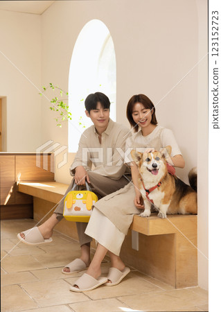 Portrait of a couple sitting with a dog Portrait of a couple sitting with a dog 123152723