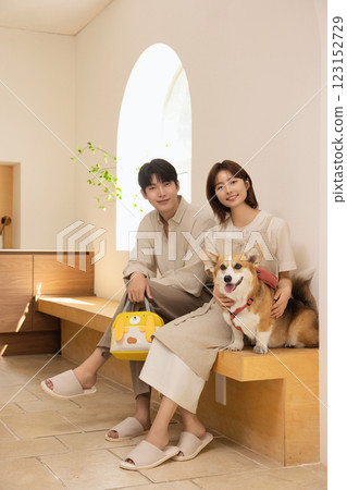 Portrait of a couple sitting with a dog 123152729