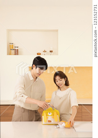 A couple preparing supplies for their dog 123152731