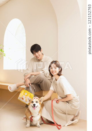 A happy couple with their dog A happy couple with their dog 123152763