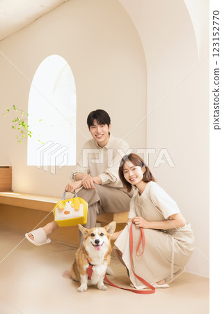 A happy couple with their dog 123152770