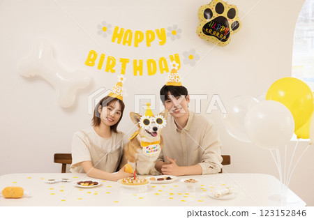 A young couple preparing for their dog's birthday party 123152846