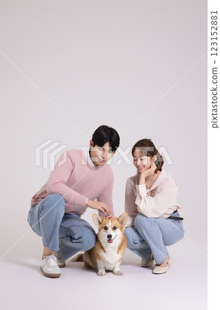 Family photo of a young couple raising a cute Welsh Corgi 123152881