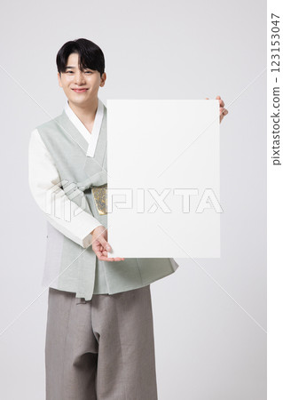 Portrait of a young man wearing hanbok and standing with copy space Portrait of a young man wearing hanbok and standing with copy space 123153047