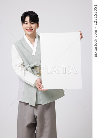 Portrait of a young man wearing hanbok and standing with copy space Portrait of a young man wearing hanbok and standing with copy space 123153051
