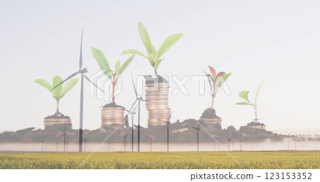 Wind turbines in field with growing plants over coins image Wind turbines in field with growing plants over coins image 123153352