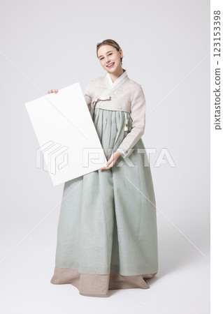 Portrait of a Western woman wearing Hanbok and standing with copyspace 123153398