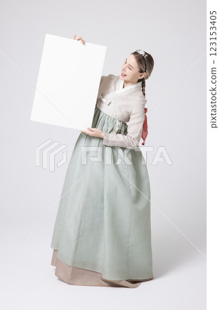 Portrait of a Western woman wearing Hanbok and standing with copyspace 123153405