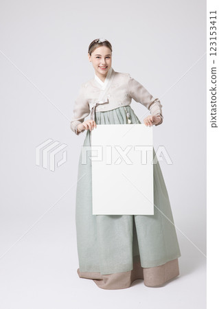 Portrait of a Western woman wearing Hanbok and standing with copyspace 123153411