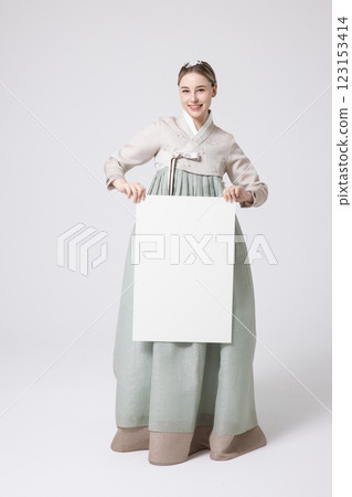 Portrait of a Western woman wearing Hanbok and standing with copyspace 123153414