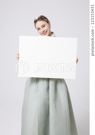 Portrait of a Western woman wearing Hanbok and standing with copyspace 123153431
