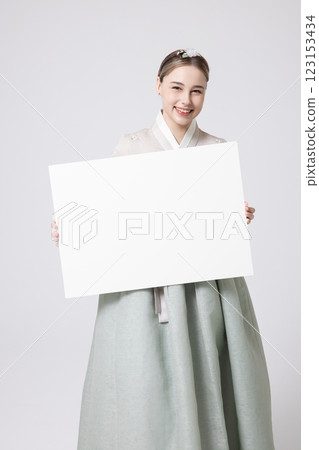 Portrait of a Western woman wearing Hanbok and standing with copyspace 123153434