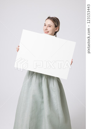 Portrait of a Western woman wearing Hanbok and standing with copyspace 123153443