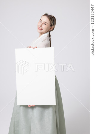 Portrait of a Western woman wearing Hanbok and standing with copyspace 123153447
