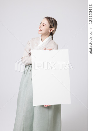 Portrait of a Western woman wearing Hanbok and standing with copyspace 123153458
