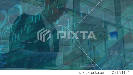 Image of financial data processing over diverse colleagues working in office Image of financial data processing over diverse colleagues working in office 123153465