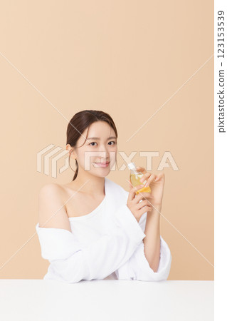 Portrait of beautiful young woman posing with oil 123153539