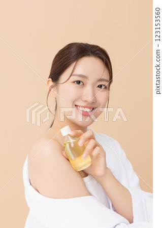 Portrait of beautiful young woman posing with oil Portrait of beautiful young woman posing with oil 123153560
