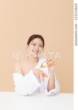 Portrait of beautiful young woman posing with oil Portrait of beautiful young woman posing with oil 123153629