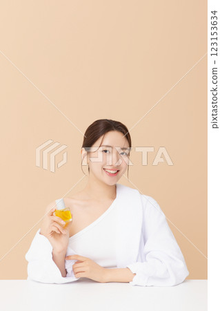 Portrait of beautiful young woman posing with oil Portrait of beautiful young woman posing with oil 123153634