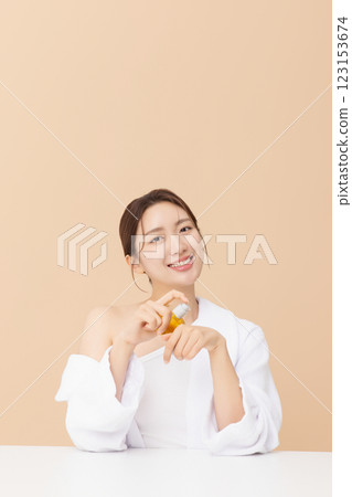 Portrait of beautiful young woman posing with oil 123153674